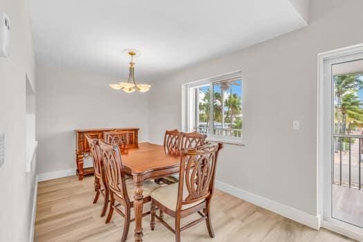 dining room with an inviting chandelier and light wood-type flooring