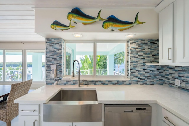 kitchen with white cabinetry and stainless steel dishwasher