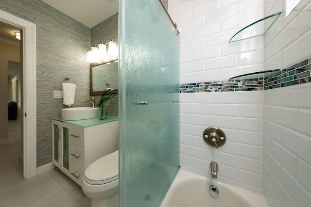 full bathroom with vanity, toilet, tiled shower / bath combo, and tile patterned flooring