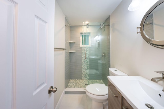 bathroom featuring an enclosed shower, vanity, and toilet