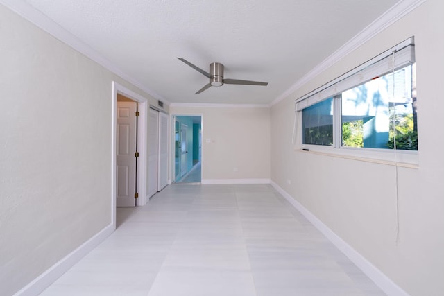 corridor with crown molding and a textured ceiling