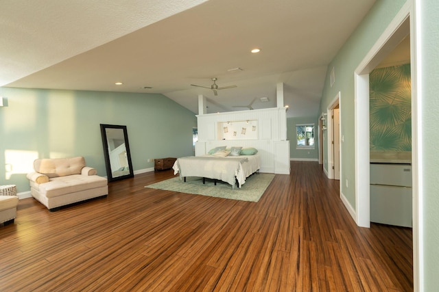 unfurnished bedroom with dark hardwood / wood-style flooring and vaulted ceiling