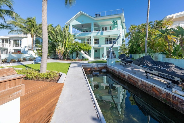 rear view of property featuring a balcony