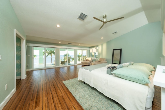 bedroom featuring lofted ceiling, dark wood-type flooring, and ceiling fan