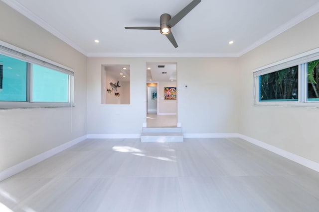 empty room with crown molding and ceiling fan