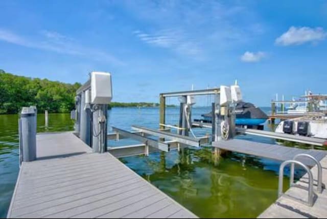 view of dock with a water view and boat lift