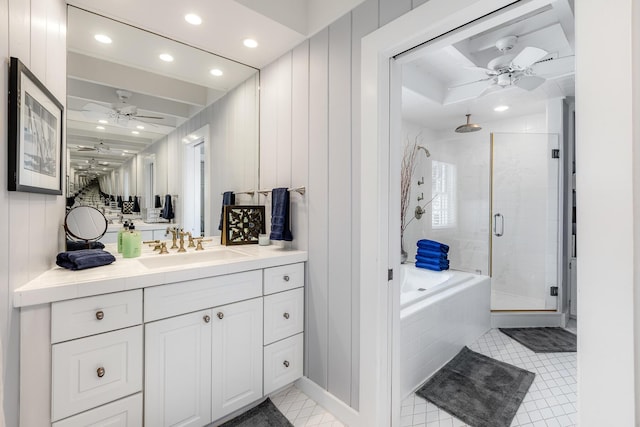 full bath featuring vanity, a shower stall, a bath, and a ceiling fan