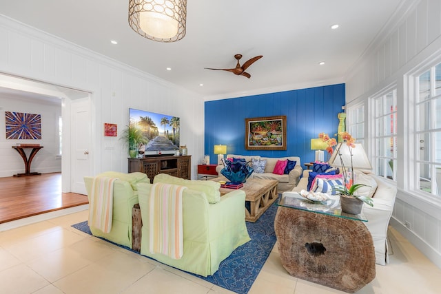 living area with recessed lighting, ceiling fan, ornamental molding, and tile patterned floors