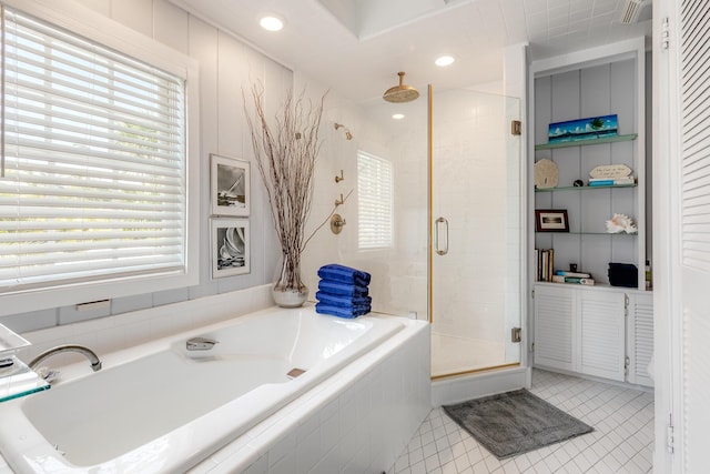 bathroom featuring a stall shower, tile patterned flooring, a bath, and recessed lighting