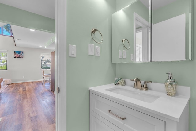 bathroom with vanity and hardwood / wood-style floors