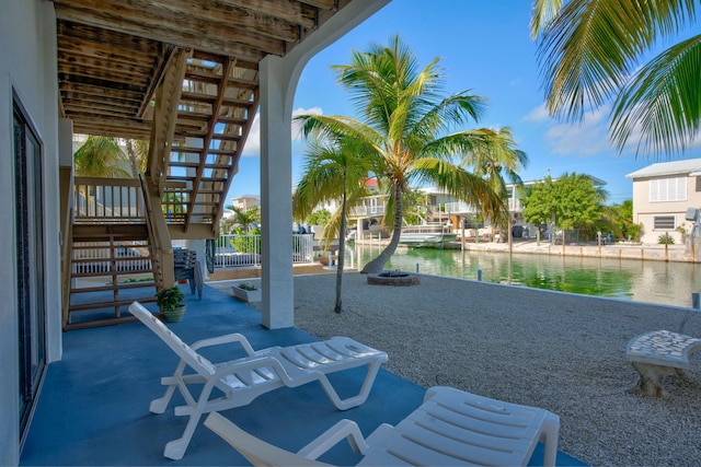 view of patio with a water view