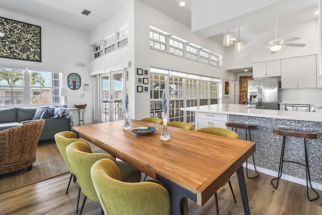171 3rd St, Key Colony, FL 33051 - dining room with a towering ceiling, a ceiling fan, light wood-style floors, and recessed lighting