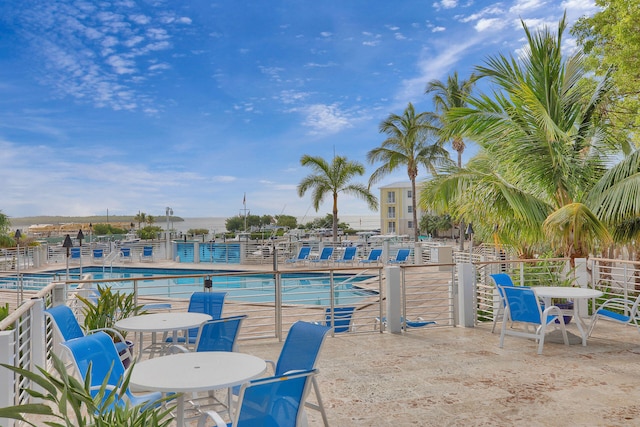 97501 Overseas Hwy Unit 705, Key Largo, FL 33037 - pool featuring a water view, a patio area, and fence