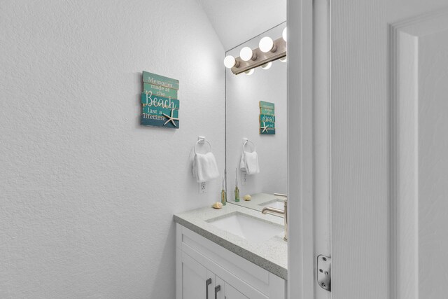 97501 Overseas Hwy Unit 705, Key Largo, FL 33037 - bathroom with a textured wall and vanity