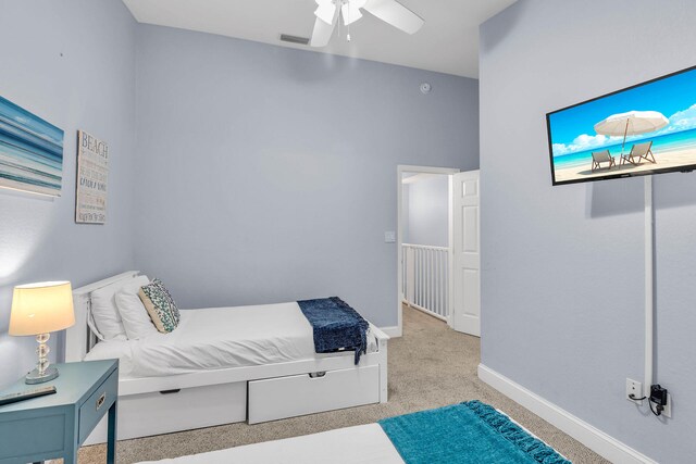 97501 Overseas Hwy Unit 705, Key Largo, FL 33037 - bedroom with light carpet, a ceiling fan, visible vents, and baseboards