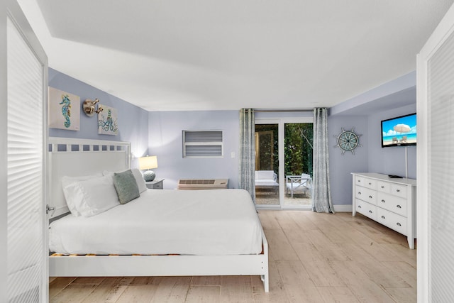 97501 Overseas Hwy Unit 705, Key Largo, FL 33037 - bedroom featuring access to exterior and light wood-style flooring