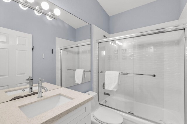 97501 Overseas Hwy Unit 705, Key Largo, FL 33037 - bathroom with combined bath / shower with glass door, vanity, and toilet