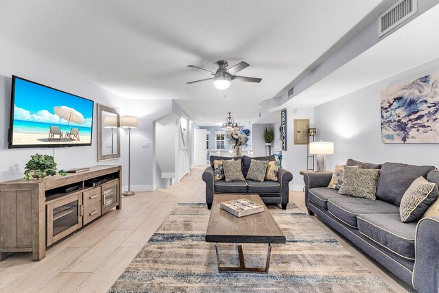 97501 Overseas Hwy Unit 705, Key Largo, FL 33037 - living area with light wood-type flooring, ceiling fan, visible vents, and baseboards