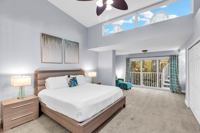 97501 Overseas Hwy Unit 705, Key Largo, FL 33037 - bedroom with high vaulted ceiling, access to outside, light colored carpet, and ceiling fan