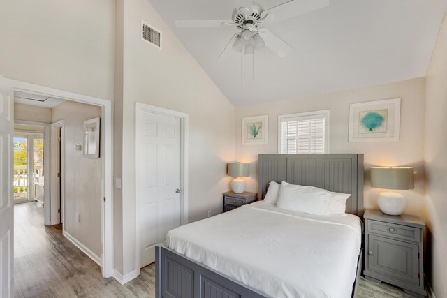 bedroom with vaulted ceiling, ceiling fan, and light hardwood / wood-style flooring