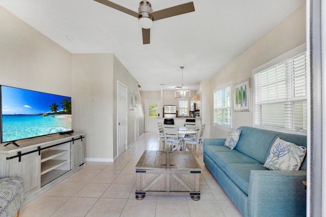 living room featuring light tile patterned floors and ceiling fan