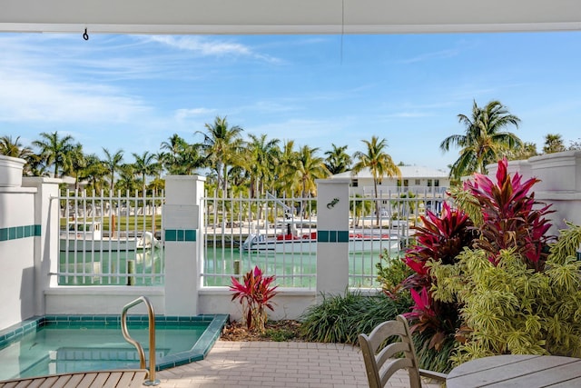 view of swimming pool with a water view