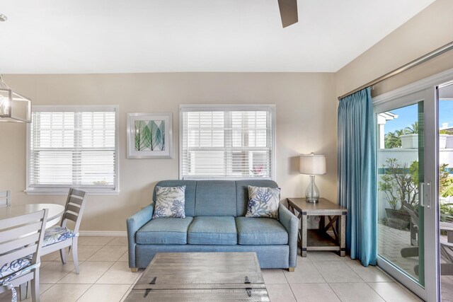 living room featuring light tile patterned flooring and a wealth of natural light