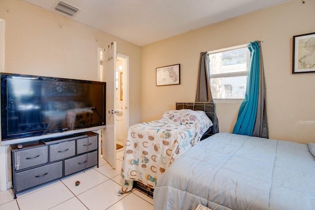 711 Sharon Pl, Key Largo, FL 33037 - tiled bedroom featuring ensuite bath
