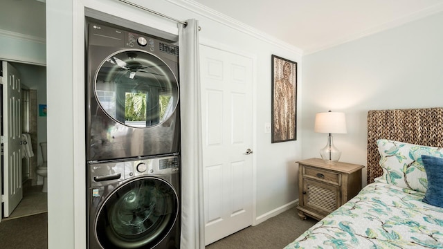 101 Front St Unit 8, Key West, FL 33040 - laundry room with stacked washer / dryer, carpet flooring, and ornamental molding