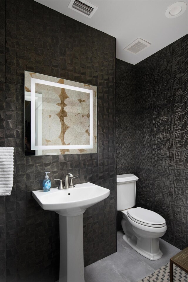 22 Floral Ave, Key Haven, FL 33040 - bathroom with backsplash, tile patterned floors, and toilet