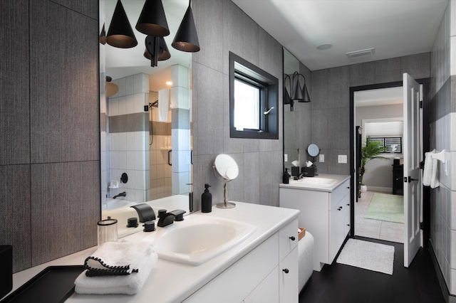 22 Floral Ave, Key Haven, FL 33040 - bathroom with vanity, bathing tub / shower combination, and tile walls