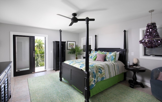 22 Floral Ave, Key Haven, FL 33040 - tiled bedroom with access to outside and ceiling fan