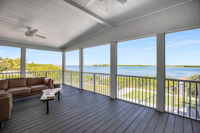 sunroom featuring a water view, lofted ceiling with beams, and ceiling fan