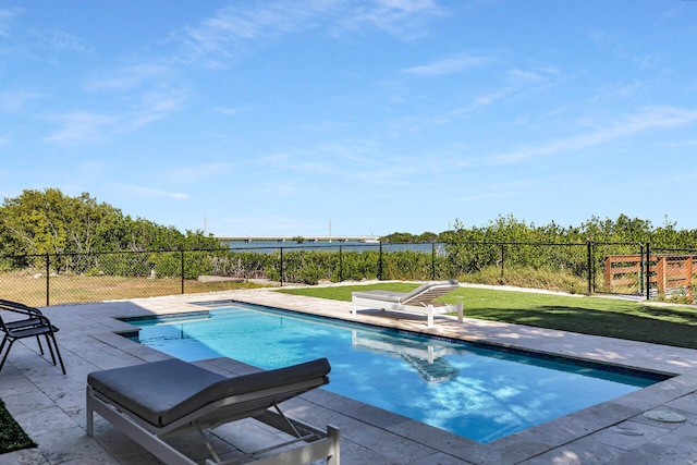 view of pool featuring a patio and a lawn