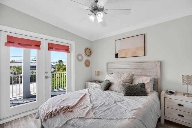 bedroom featuring french doors, access to outside, ceiling fan, hardwood / wood-style floors, and crown molding