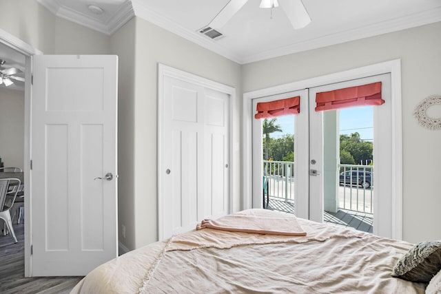 bedroom featuring hardwood / wood-style flooring, access to outside, crown molding, and french doors