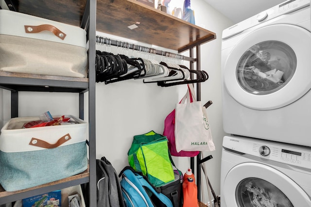 laundry area with stacked washer and clothes dryer