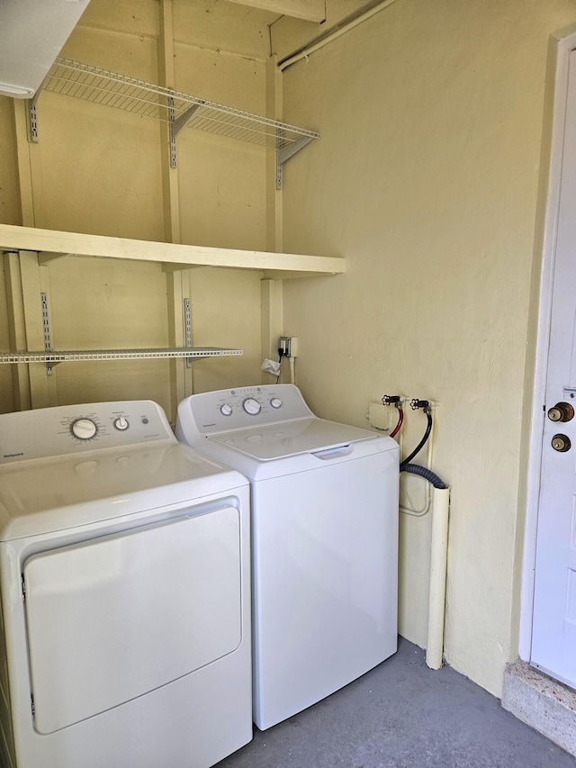 laundry room with separate washer and dryer