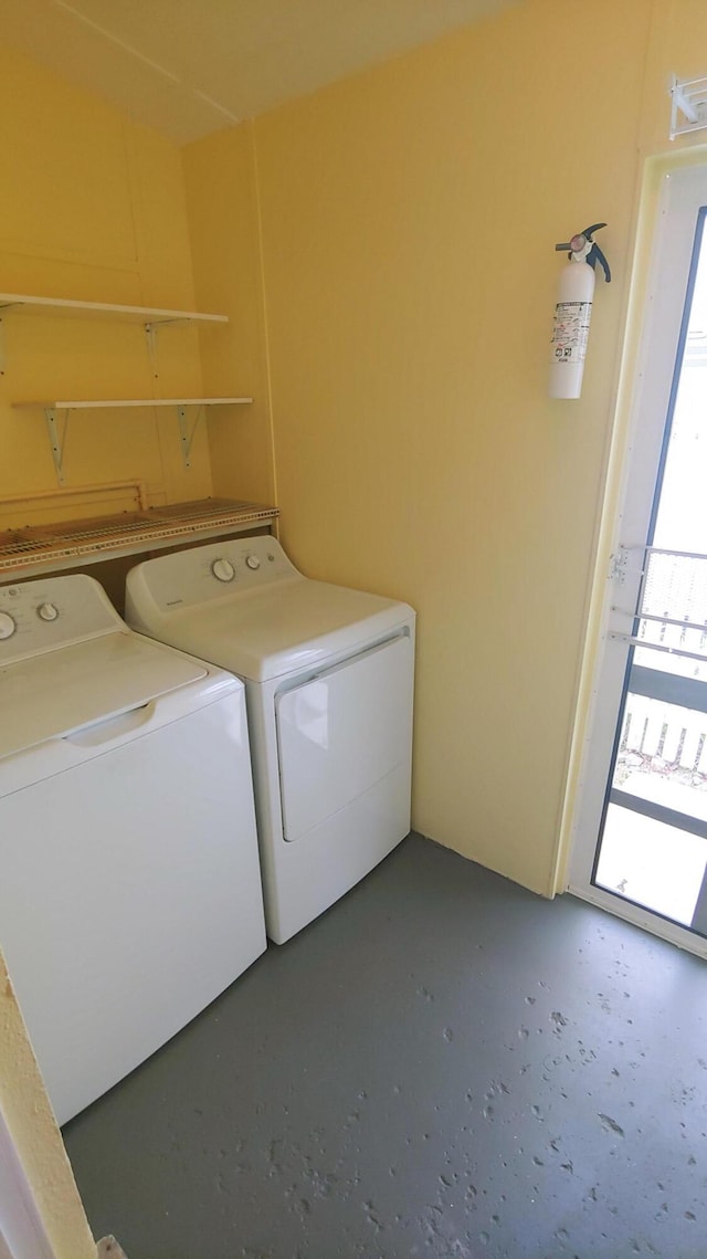 clothes washing area featuring washer and dryer