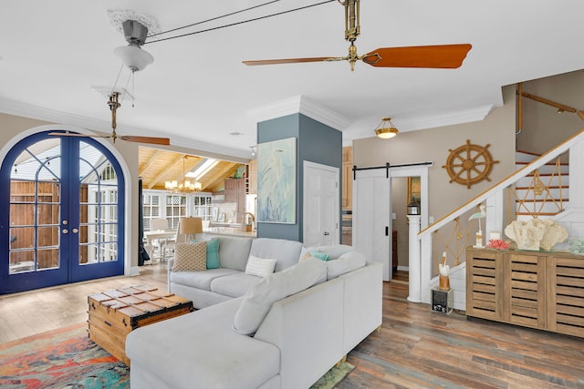 1001 United St Unit B, Key West, FL 33040 - living room with a chandelier, french doors, crown molding, wood finished floors, and stairway
