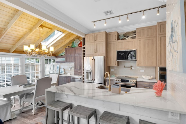 1001 United St Unit B, Key West, FL 33040 - kitchen featuring stainless steel appliances, open shelves, a chandelier, a peninsula, and backsplash