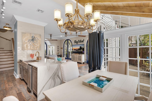 1001 United St Unit B, Key West, FL 33040 - dining space with a chandelier, dark wood finished floors, crown molding, and stairway