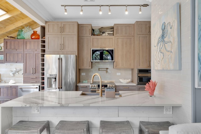 1001 United St Unit B, Key West, FL 33040 - kitchen with appliances with stainless steel finishes, open shelves, backsplash, and a kitchen breakfast bar