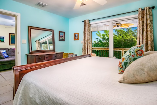 tiled bedroom featuring ceiling fan