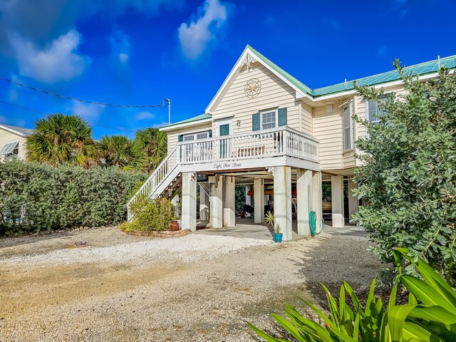 view of front of house featuring a carport and covered porch