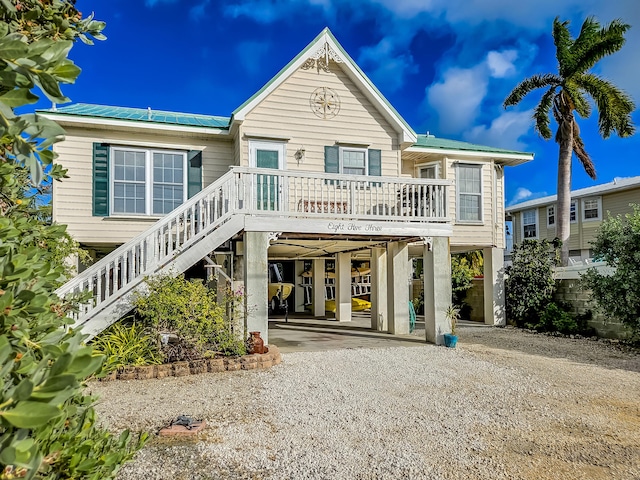 rear view of property featuring a carport