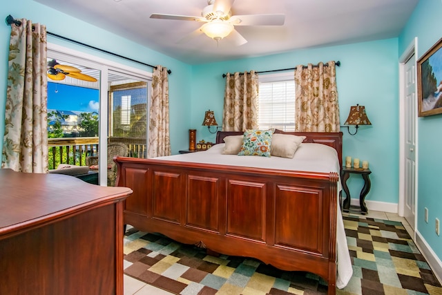 bedroom with ceiling fan and access to outside