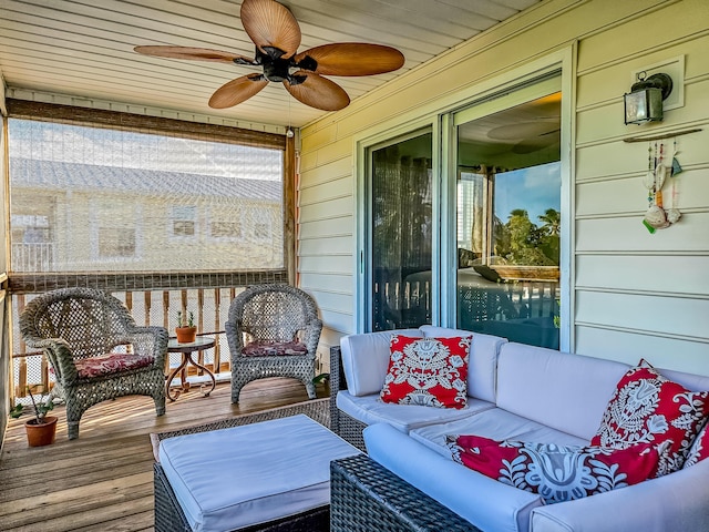 sunroom featuring ceiling fan