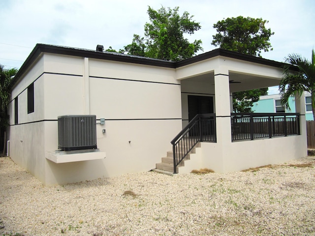 view of side of property featuring central air condition unit