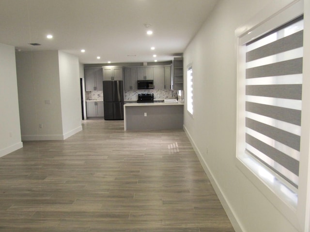 unfurnished living room featuring dark hardwood / wood-style flooring